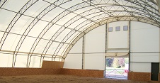 Tensioned membrane buildings can have arched roofs