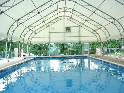 Tensioned membrane buildings are light and warm making them ideal for swimming pools